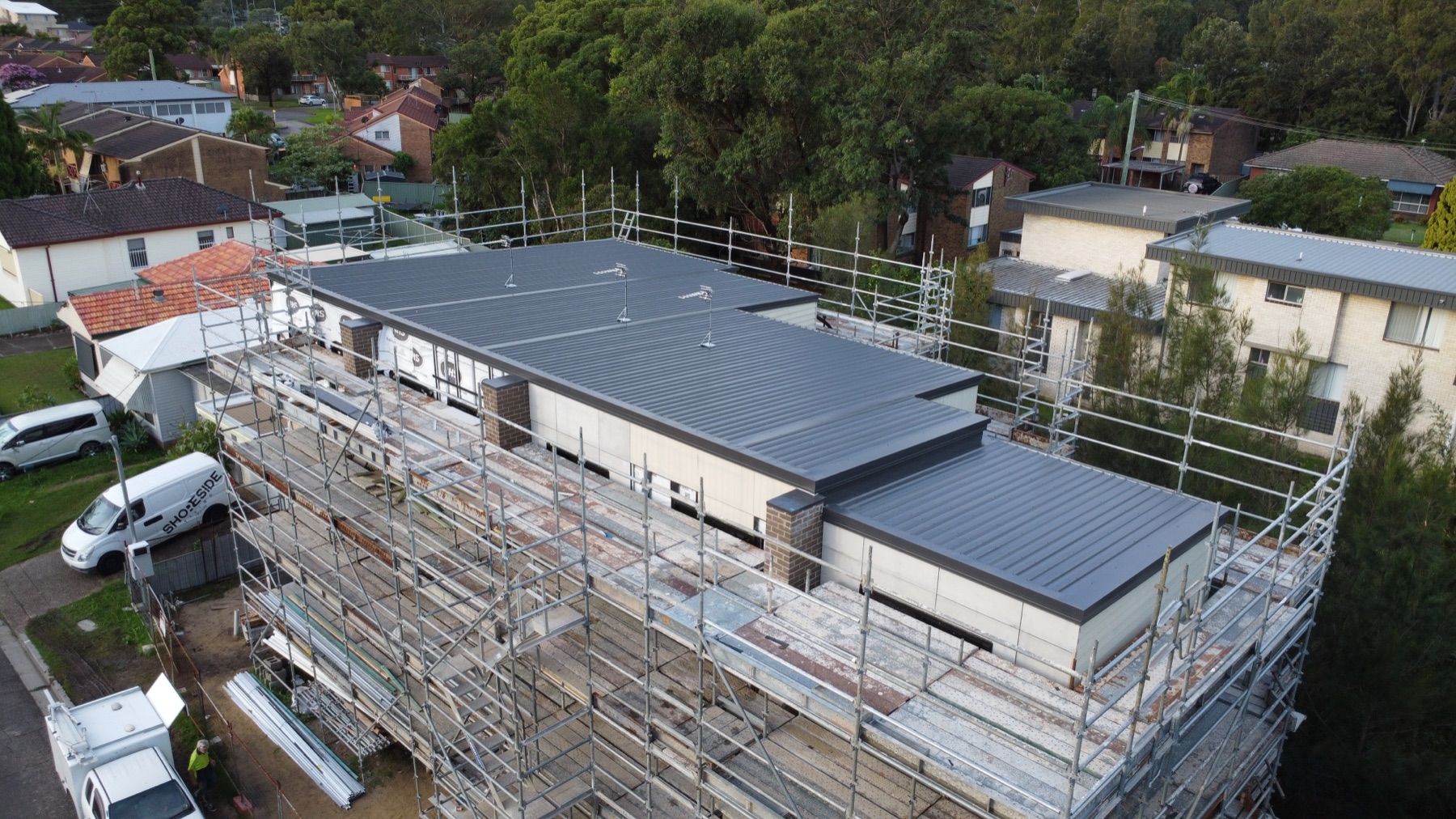 Drone view along a new roof on a unit development, Jesmond