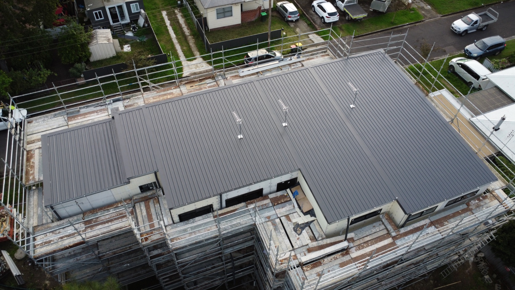 Drone view of a new Colorbond roof on a unit development, Jesmond
