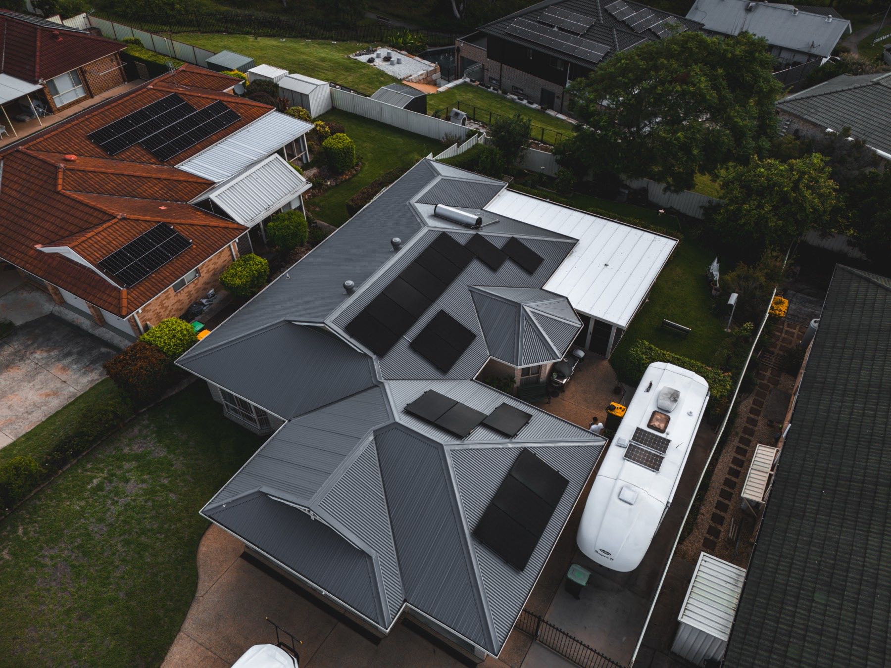 Wide aerial of a completed re-roof and property