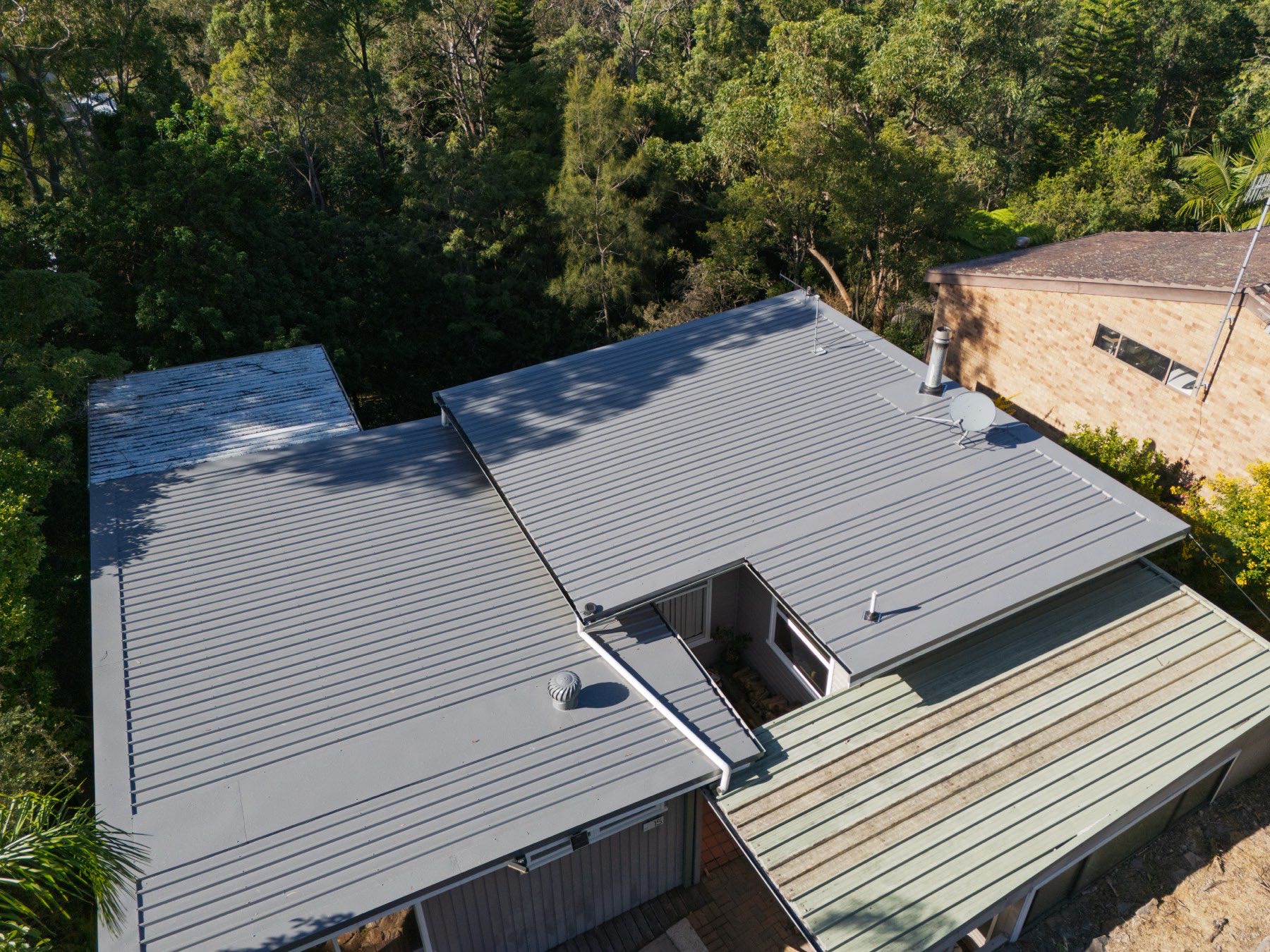 Top-down drone view of new metal roof sheeting