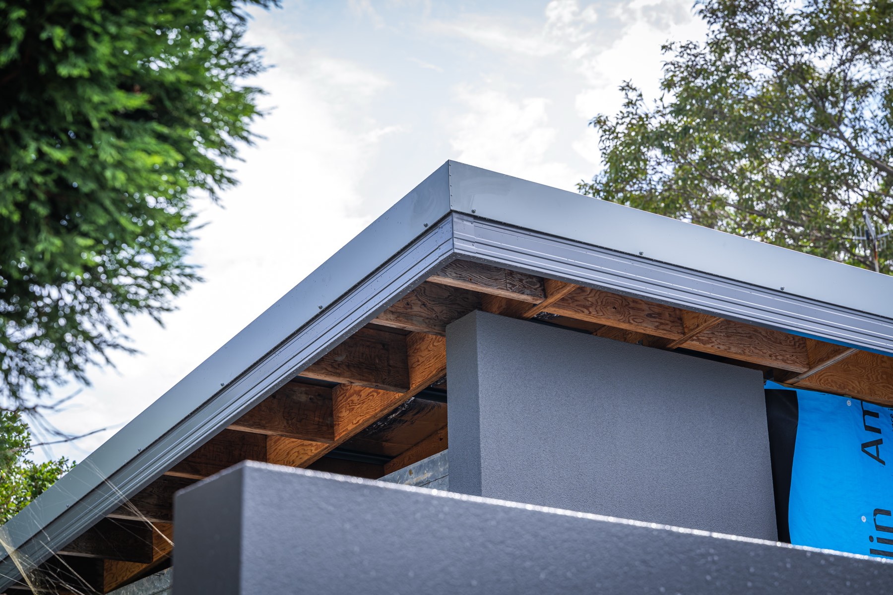 Roof edge and exposed timber framing during construction