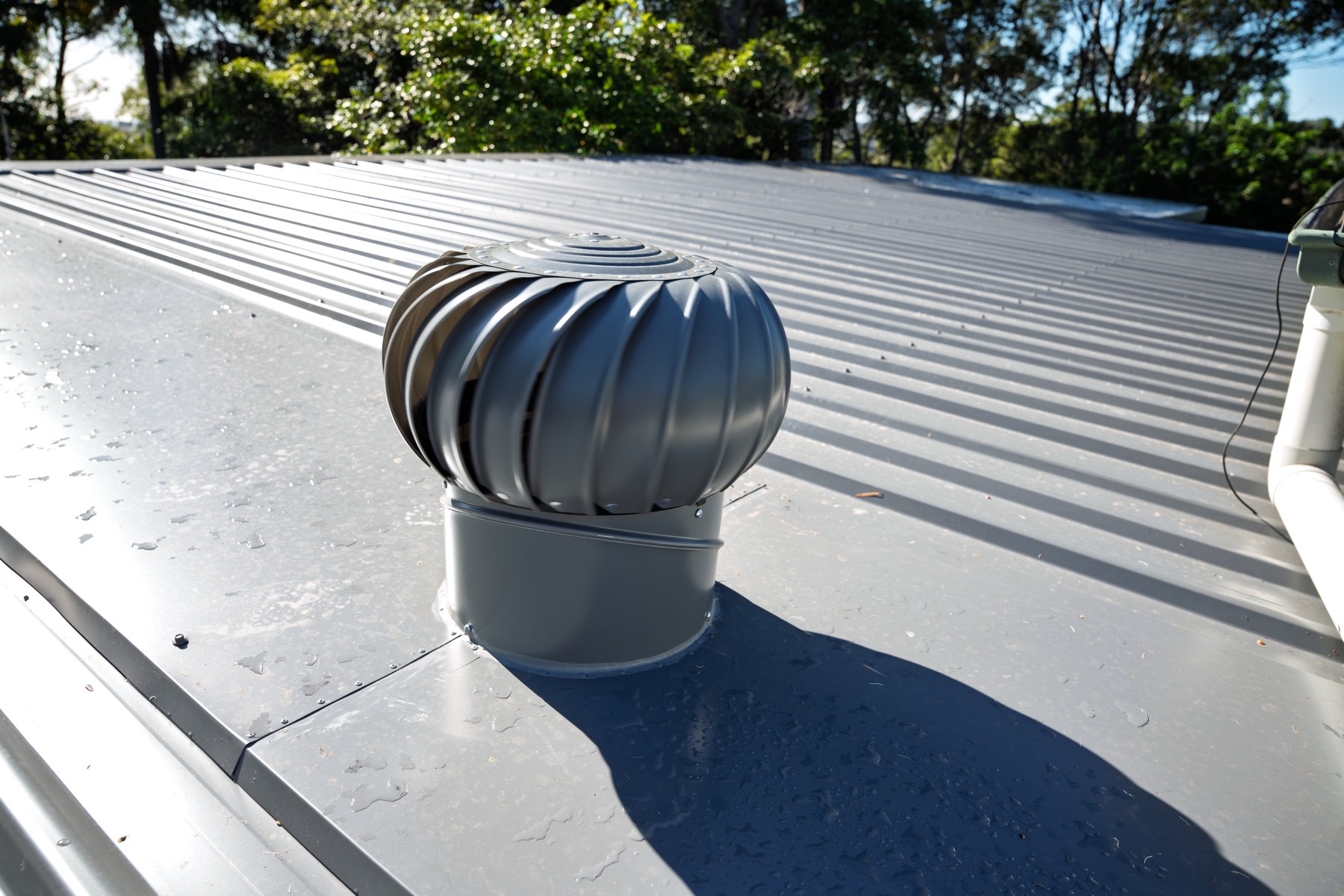 Whirlybird roof vent installed on a new metal roof